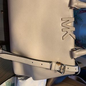 Michael Kors Florence handled cream colored purse with cross body strap